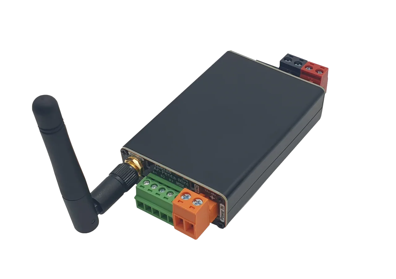 QuinLED An-Penta-Mini on white, black anodised case with green B1-B3 output, orange Power IN and red/black terminals and angled WiFi antenna