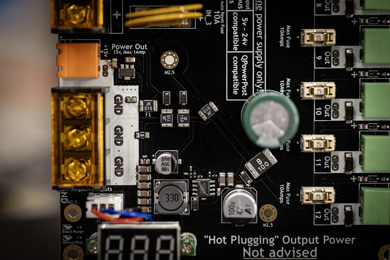 QuinLED Dig-Octa Power-5HV macro close-up of the 15V power-out and GND bolt terminals, inductor and surrounding SMD components