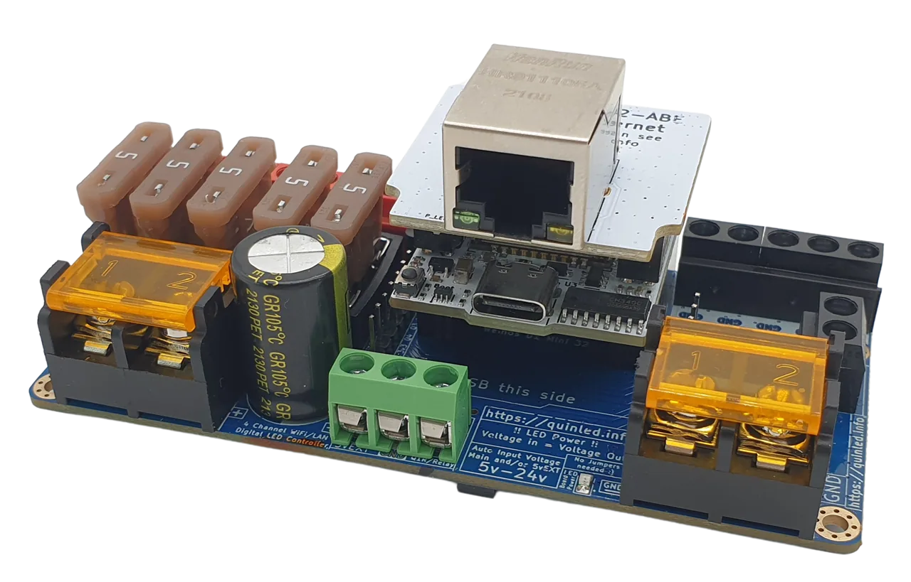 QuinLED Dig-Quad angled with an Ethernet RJ45 module, USB-C, fuse row, orange terminals and green screw terminal