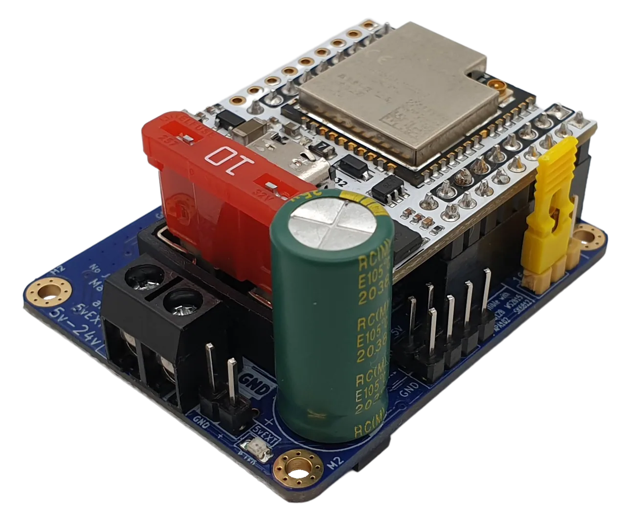 QuinLED Dig-Uno angled view, ESP32 board, red blade fuse, green capacitor, yellow jumper and screw terminals
