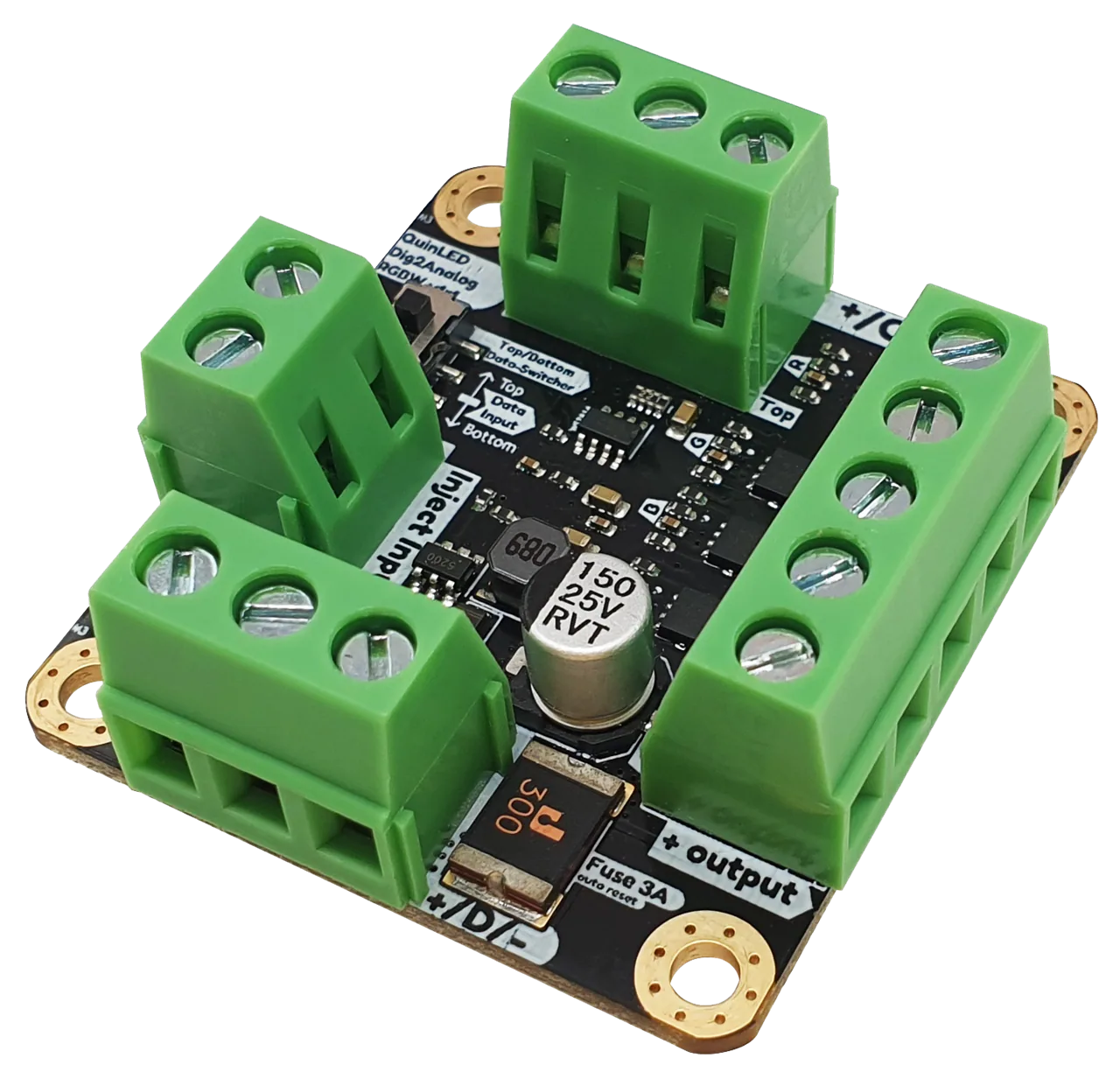 QuinLED dig2analog black PCB angled view, four green screw terminals, a slide data-switch, silver capacitor and 3A resettable fuse