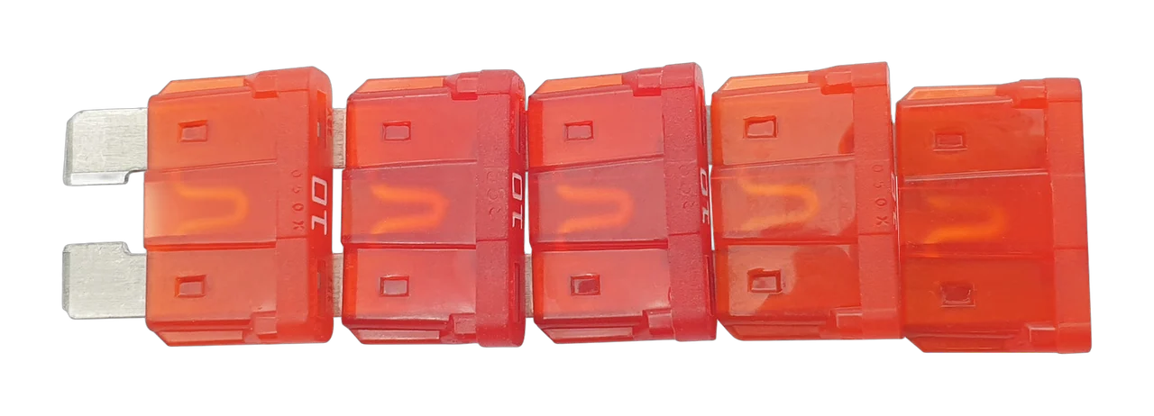 A QuinLED replacement fuse pack of five red 10A ATO blade fuses, lined up