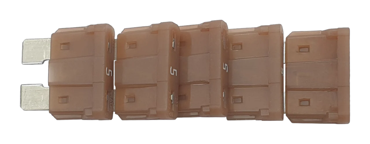 A QuinLED replacement fuse pack of five tan 5A ATO blade fuses, lined up